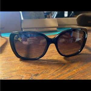 Medium size Square black Burberry sunglasses w/ the Burberry colors on the side.
